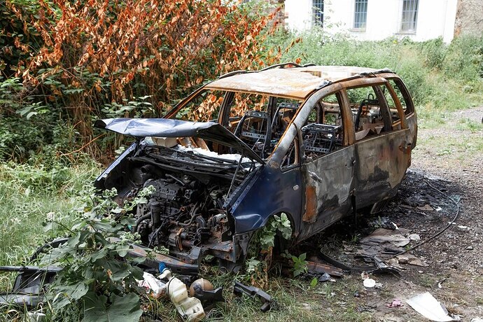 car-after-fire-burnt-rusty-car-after-fire-accident-car-after-fire-crime-vandalism-riots-arson-car-accident-road-due-speeding-explosion_94120-2118